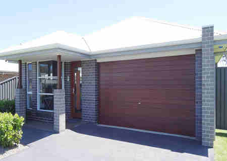 Automatic roll up garage door